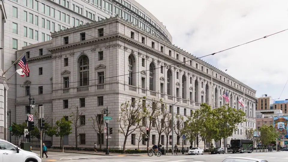 A neoclassical courthouse building on a city street in San Francisco