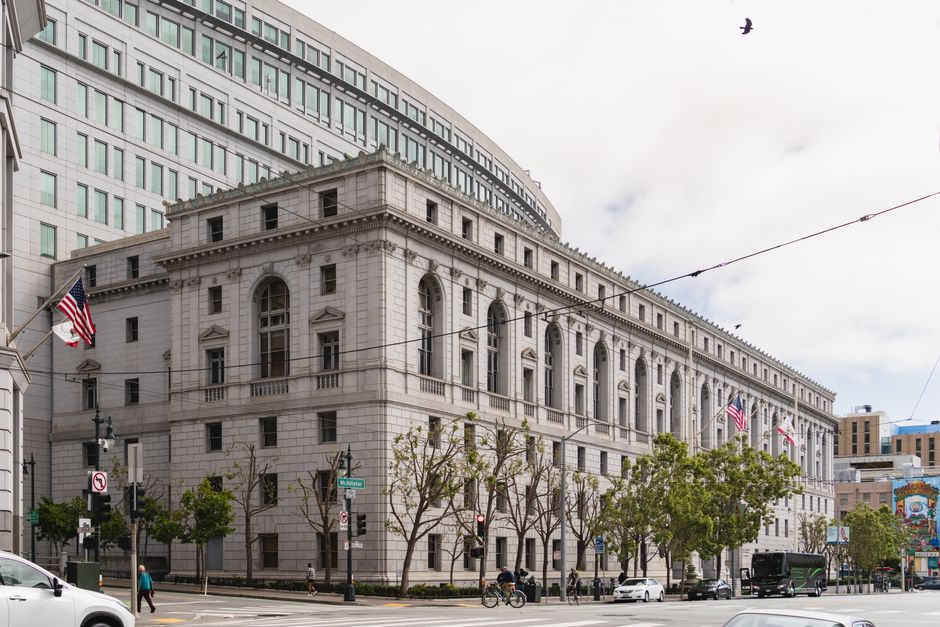 A neoclassical courthouse building on a city street in California